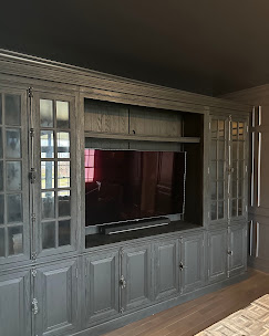 TV mounted within custom built-in cabinetry