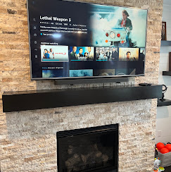TV mounted above a bedroom dresser